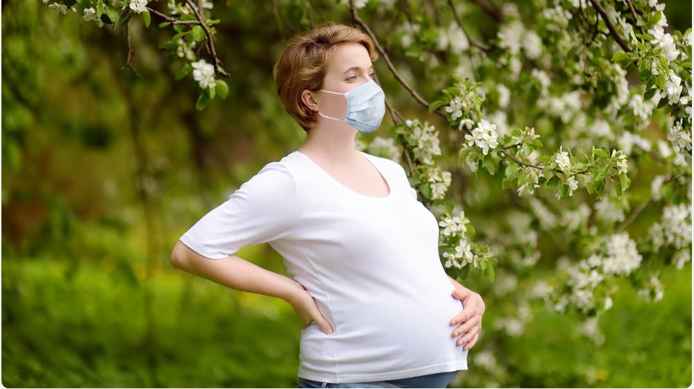 pregnant person wearing mask